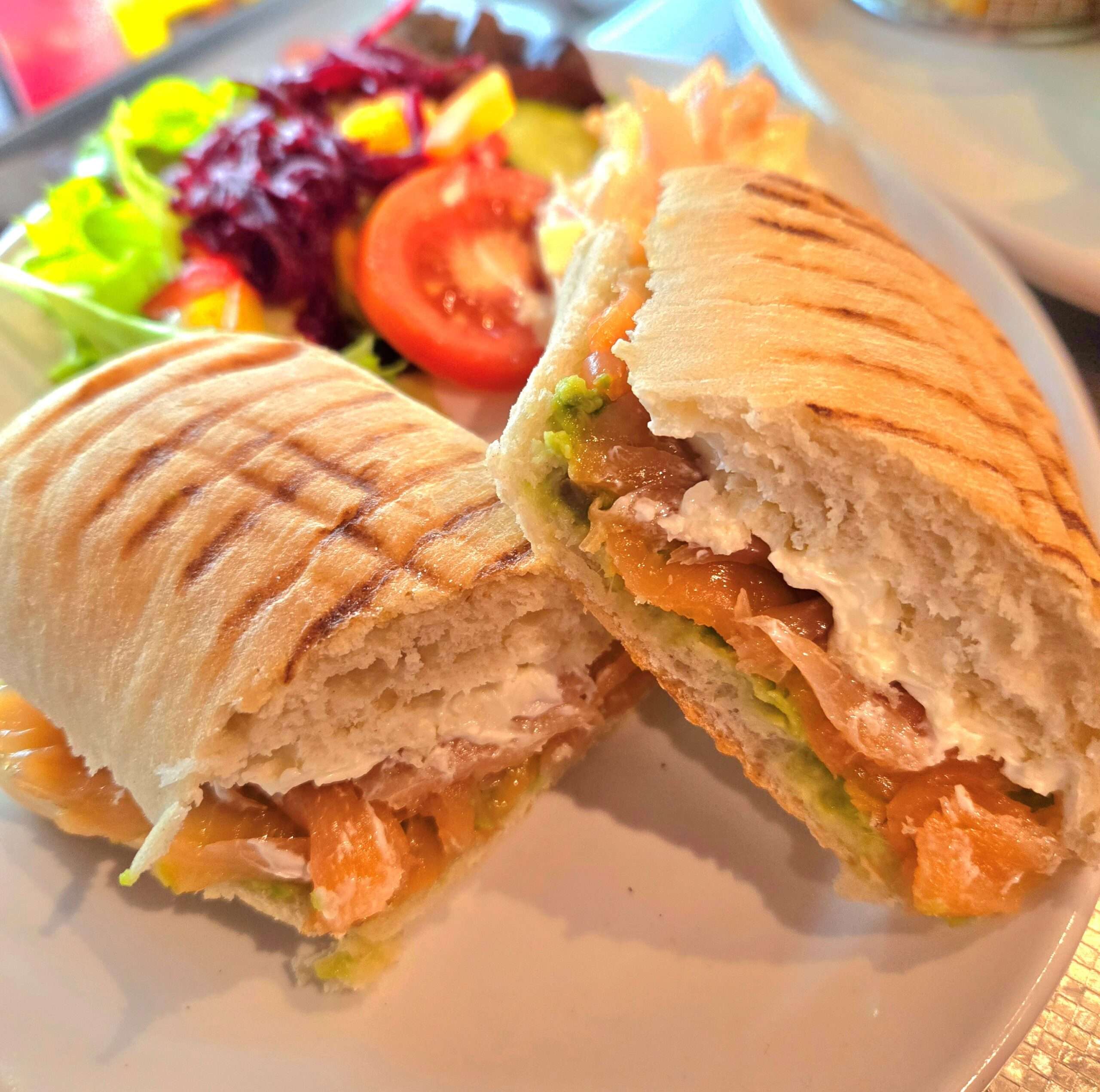 Freshly prepared toasted panini with salad garnish, served at Time Out Coffee and Food in Diss.