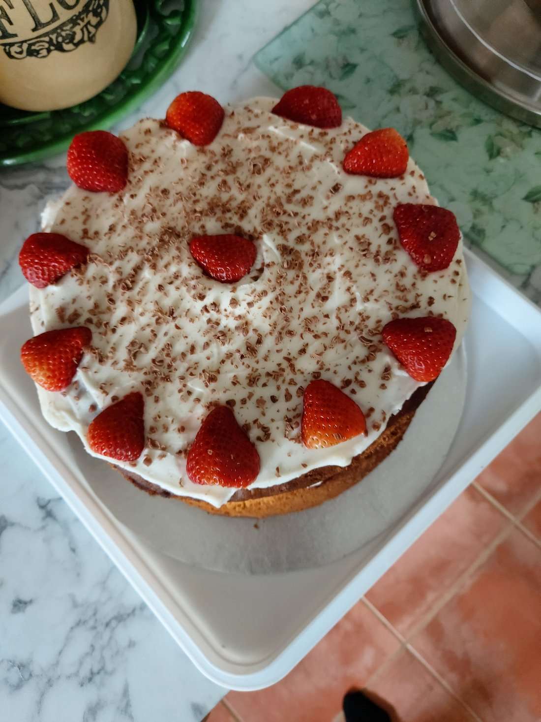 Homemade sponge cake topped with cream, chocolate shavings and fresh strawberries at Chalfonts Café in Hingham.
