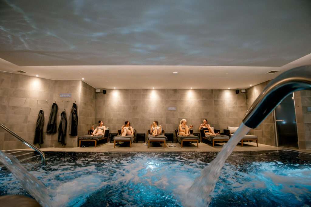 Indoor spa pool at Norfolk Mead Hotel with ambient lighting and relaxation area.