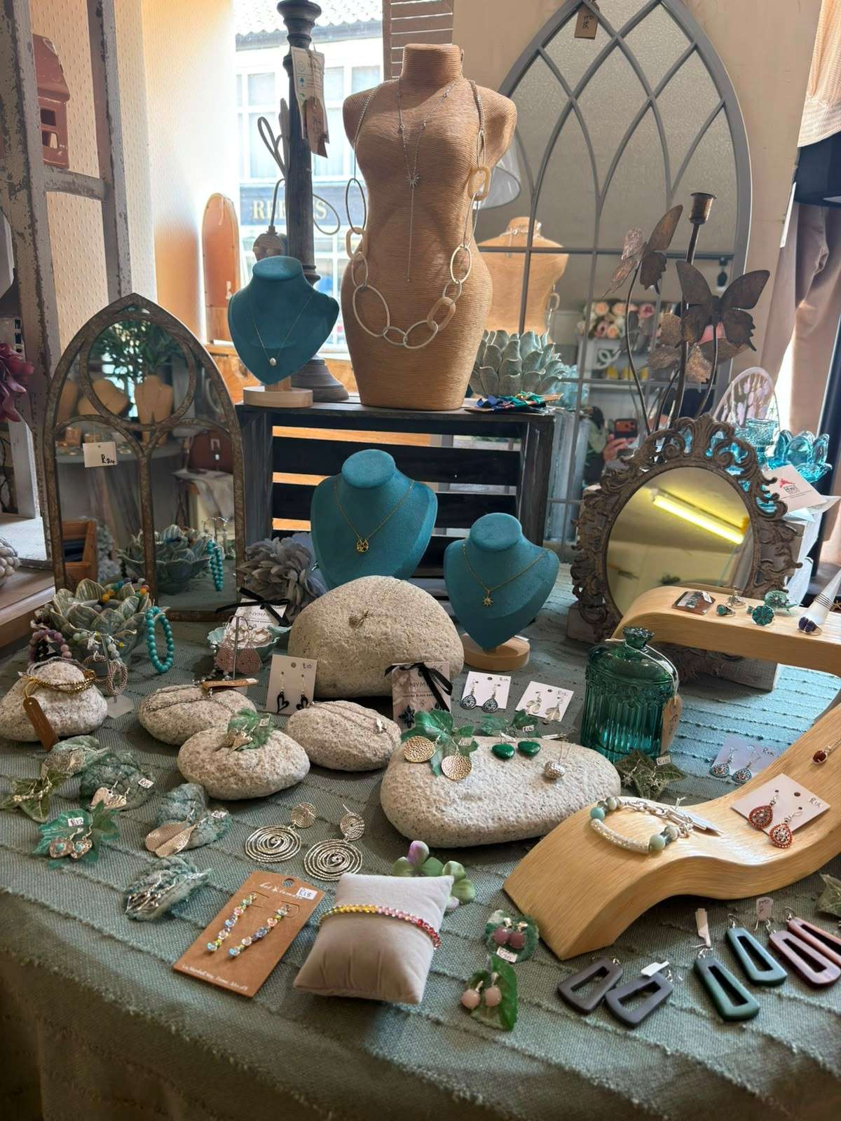 Collection of jewellery, accessories, decorative ornaments and homeware displayed inside Ebony Interiors, Wymondham.