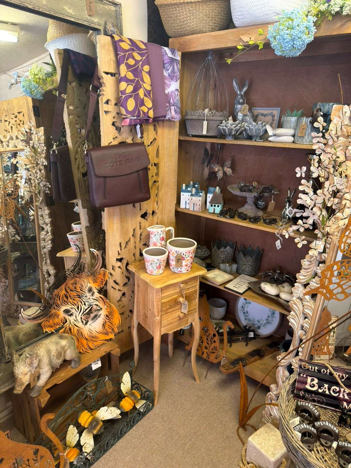 Display of women's accessories, handbags, gifts and decorative homeware inside Ebony Interiors, Wymondham.