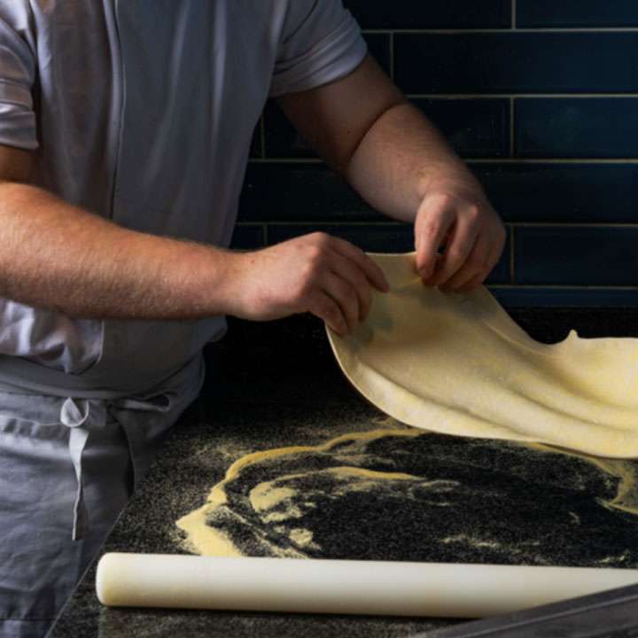 Chef preparing handcrafted pizza dough at the Town House Thorpe St Andrew Norwich